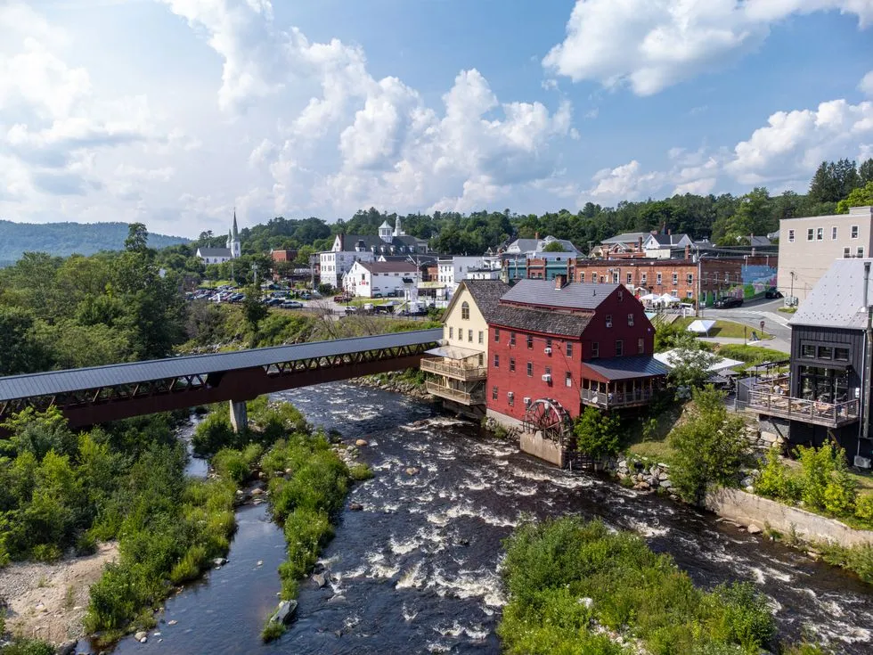 Buildings shown sitting on the banks of the river flowing through Littleton New Hampshire